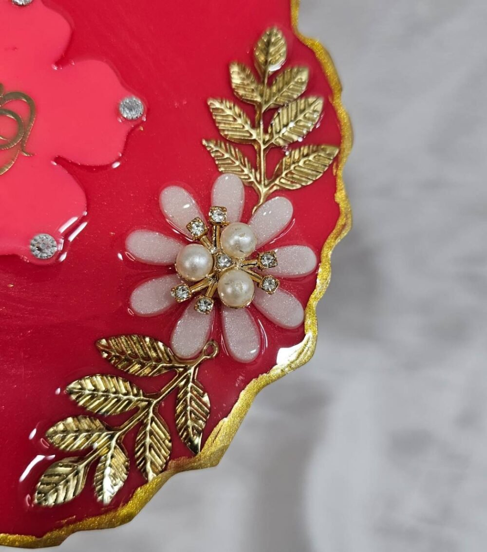 Decorative maroon resin Ganesh thali with spiritual design