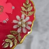 Decorative maroon resin Ganesh thali with spiritual design
