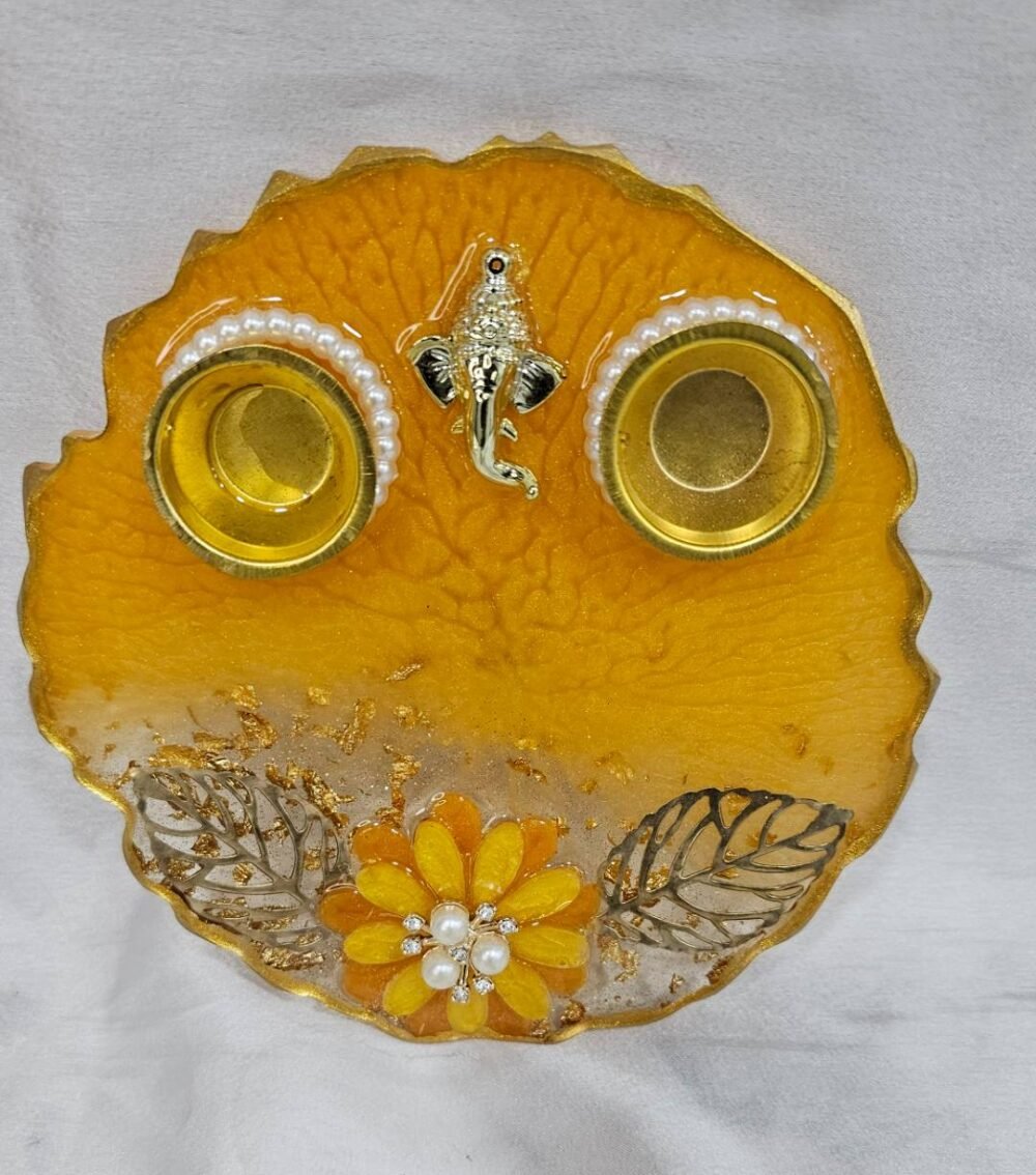 Yellow Resin Pooja Thali with Ganesha Idol and Floral Decoration