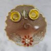 Brown resin pooja thali with Ganesha idol and diya holders