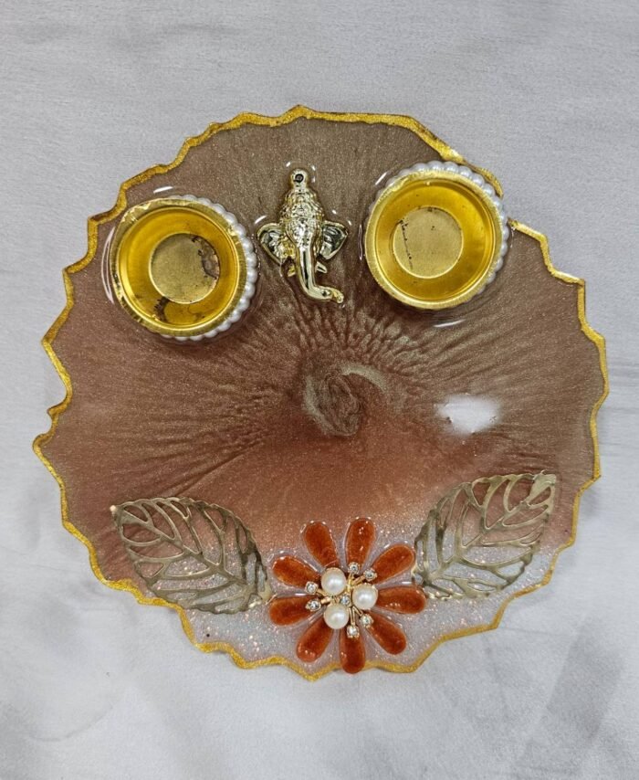 Brown resin pooja thali with Ganesha idol and diya holders