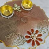 Handmade decorative pooja plate with floral and pearl design
