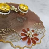 Elegant brown Ganesha pooja thali for Diwali