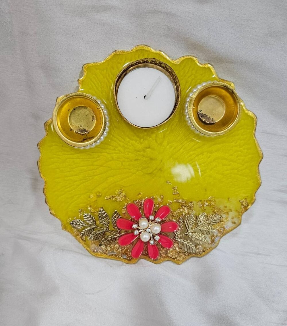Yellow resin pooja thali with floral decoration and diya holders