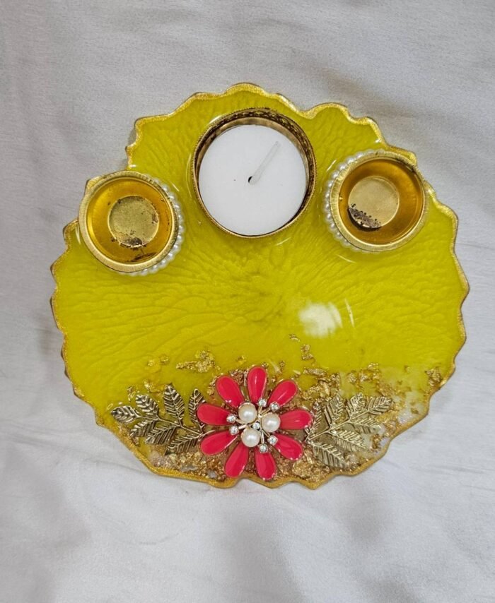 Yellow resin pooja thali with floral decoration and diya holders