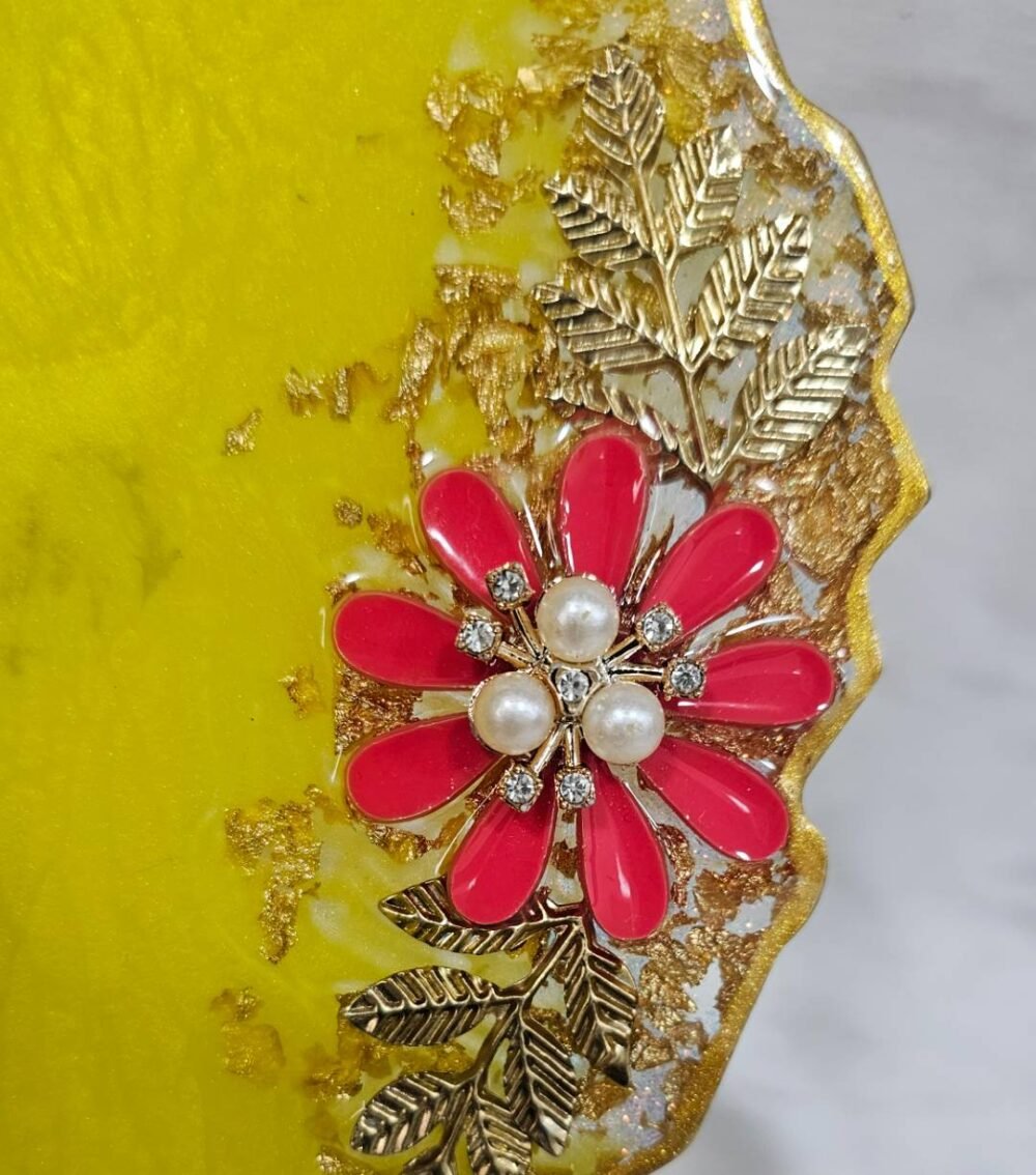 Vibrant resin pooja plate with pink flower design