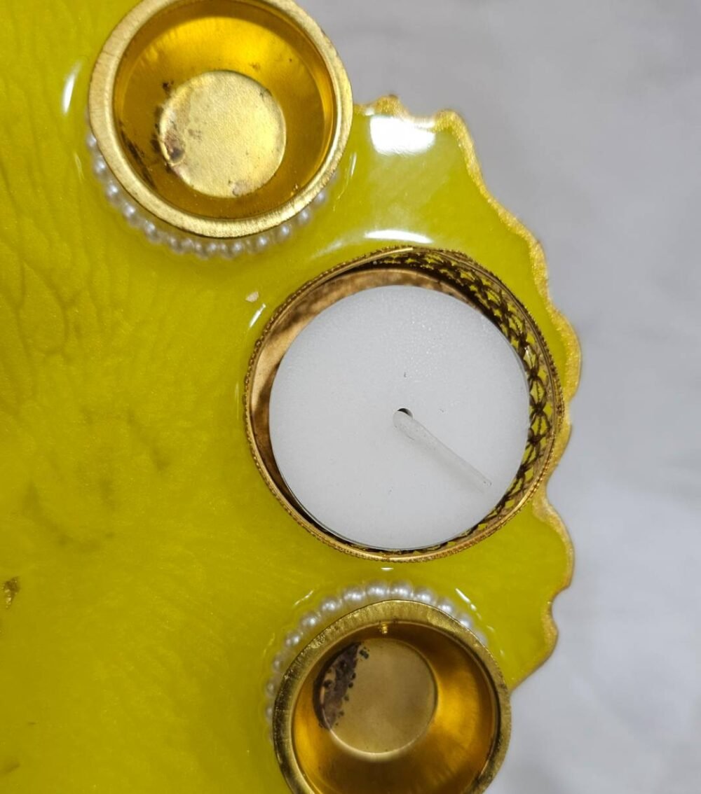 Bright yellow resin thali with golden embellishments