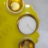 Bright yellow resin thali with golden embellishments