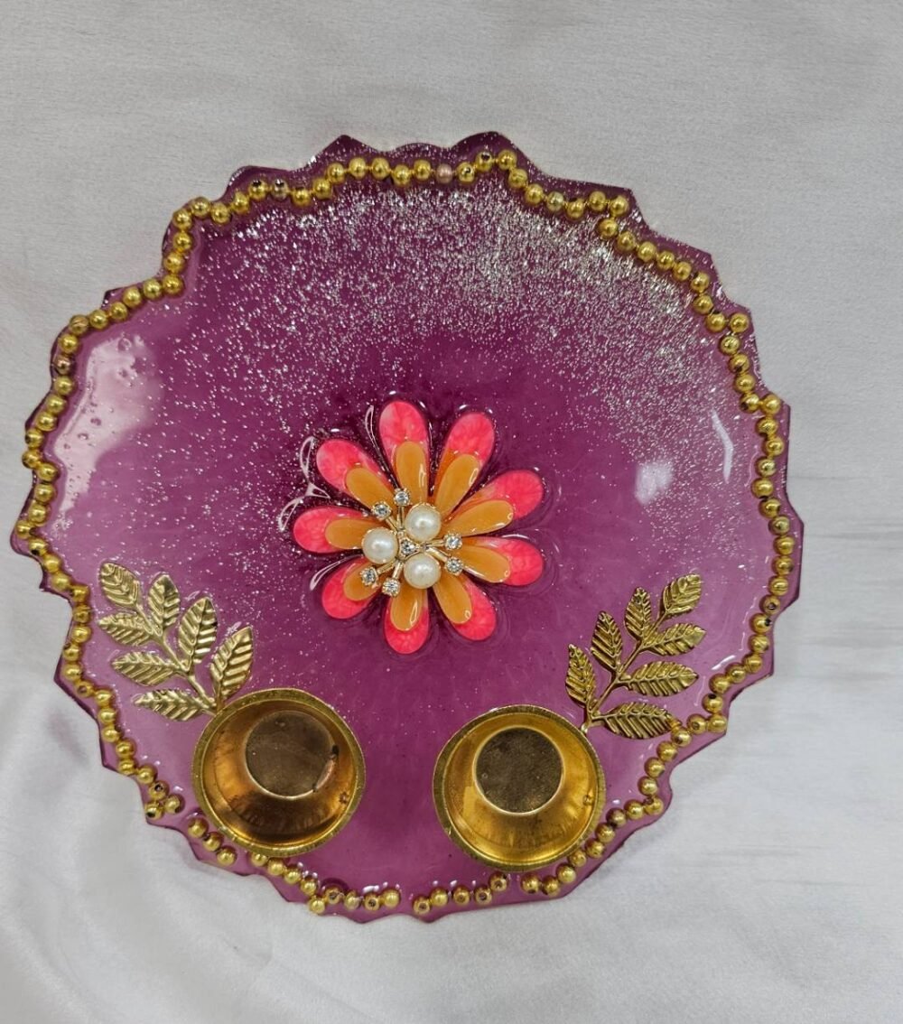 Purple resin pooja thali with floral centerpiece