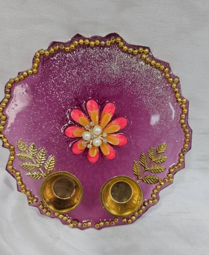 Purple resin pooja thali with floral centerpiece