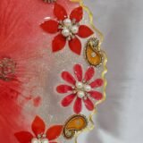Elegant handmade red pooja plate with golden accents