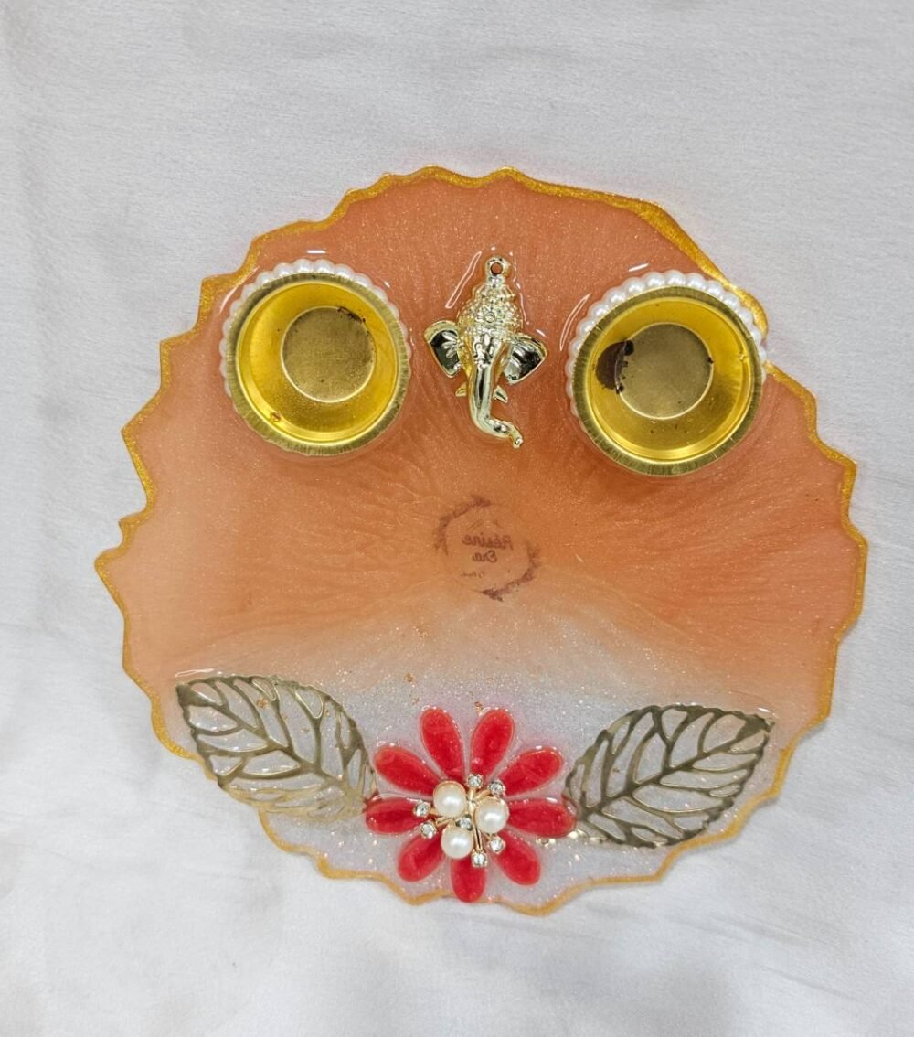 Peach resin pooja thali with Ganesha idol