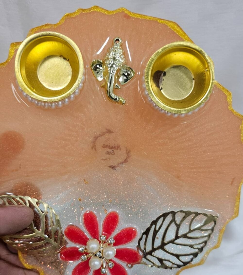 Handmade peach pooja plate with floral design