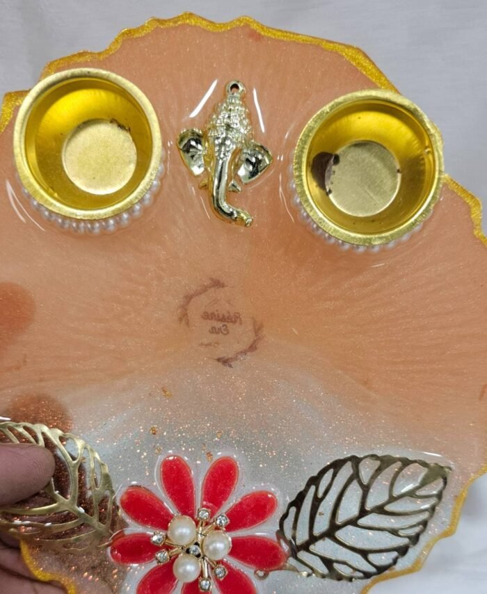 Handmade peach pooja plate with floral design
