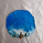 Handmade resin coaster with ocean blue wave design