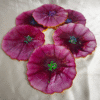 Handmade purple flower resin coasters with shimmering centers by Resineera