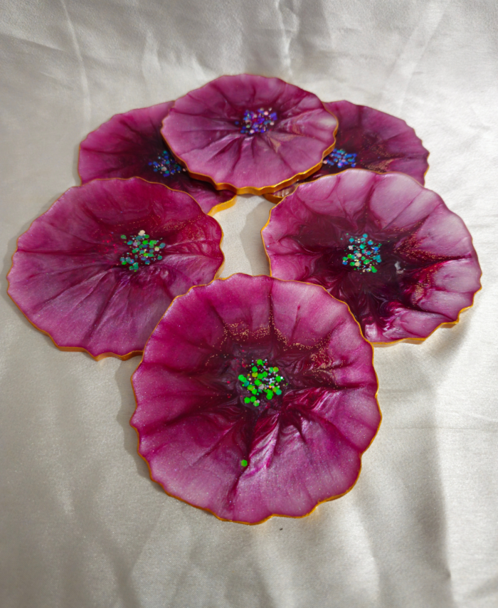 Handmade purple flower resin coasters with shimmering centers by Resineera
