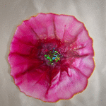 Handmade purple flower resin coasters with shimmering centers by Resineera