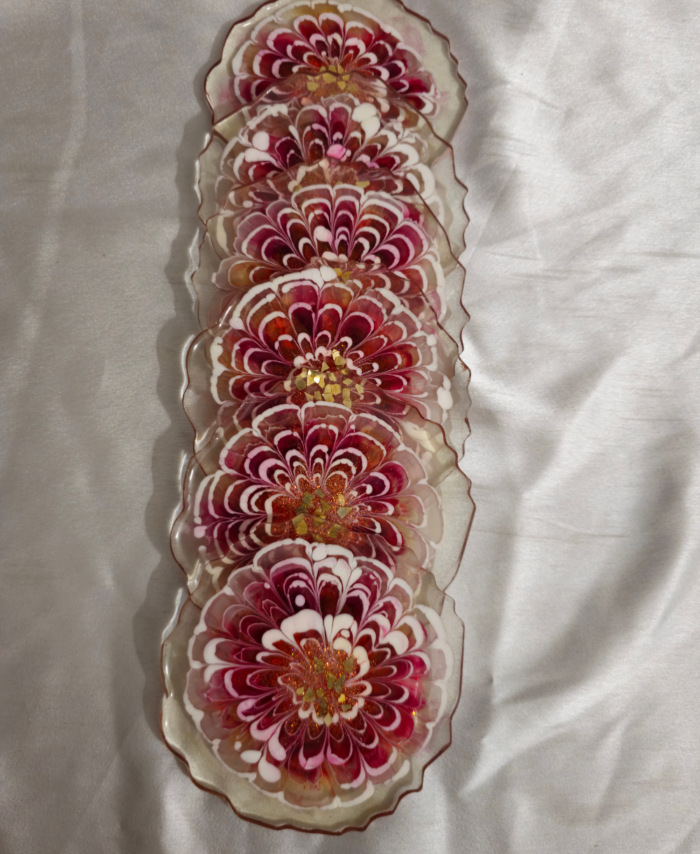 Resin coaster with gold glitter center bloom pattern