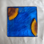 Handmade square blue resin and wood coaster with ocean-inspired design by Resineera