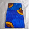 Handmade square blue resin and wood coaster with ocean-inspired design by Resineera