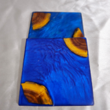 Handmade square blue resin and wood coaster with ocean-inspired design by Resineera