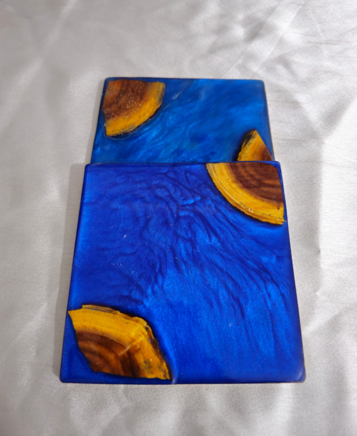 Handmade square blue resin and wood coaster with ocean-inspired design by Resineera
