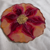 Handcrafted red and gold flower-shaped resin coaster with crystal embellishments