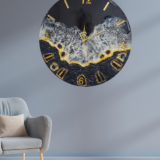 Black resin wall clock with golden ocean wave design