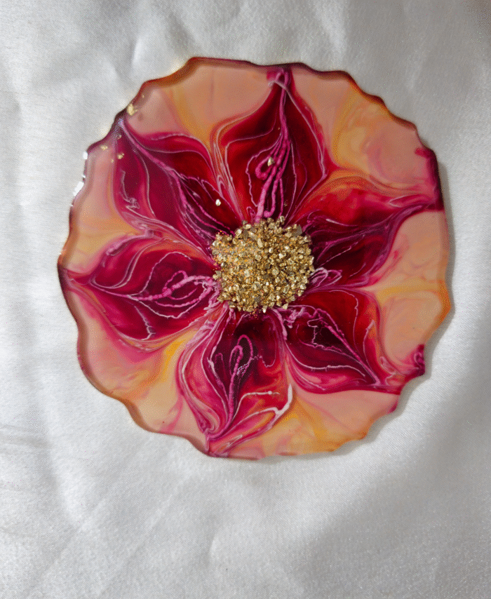 Handcrafted red and gold flower-shaped resin coaster with crystal embellishments