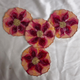 Handcrafted red and gold flower-shaped resin coaster with crystal embellishments