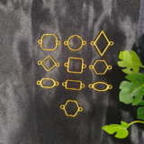 “Golden assorted double-sided hooks in mixed shapes displayed on a black background – resin jewellery base set.”