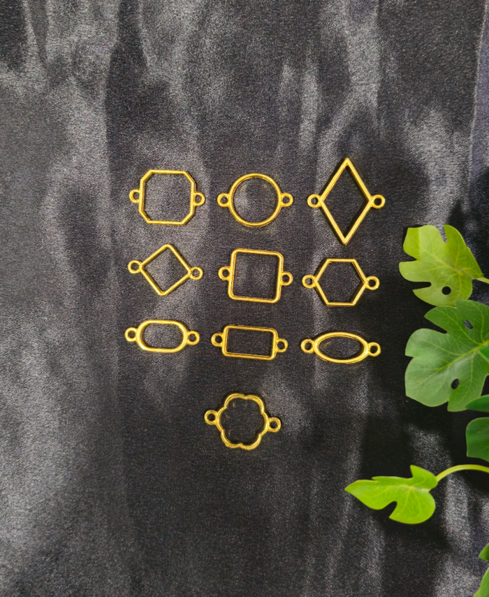 “Golden assorted double-sided hooks in mixed shapes displayed on a black background – resin jewellery base set.”
