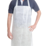 “White disposable waterproof apron sheet placed on black fabric background