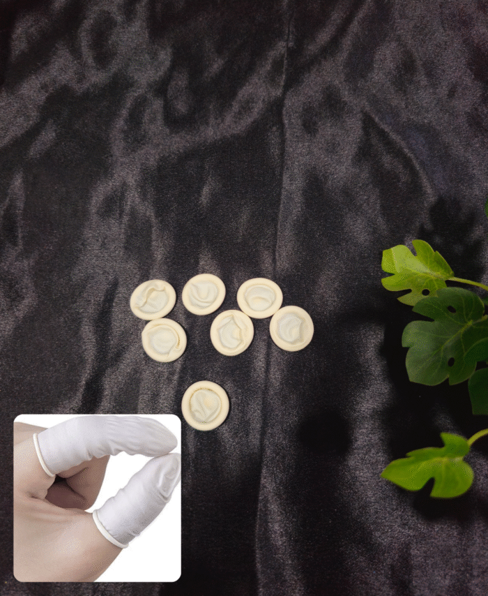 Latex finger protectors arranged on a black background for resin and craft use. Close-up of a hand wearing latex finger protectors for safe and clean crafting.