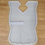 White silicone open-book resin mould with heart-shaped center design placed on a wooden surface.