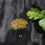 Gold Metal Jump Rings for Jewellery Making on Black Background
