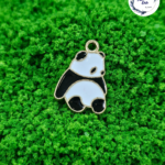 Decorative craft Panda charms for resin art and jewellery making are displayed on a soft background