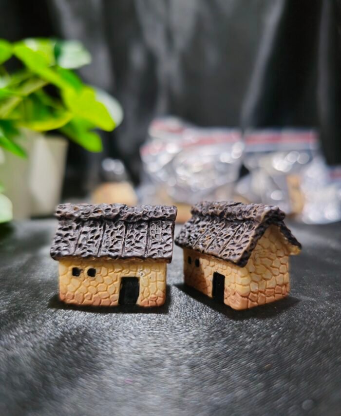 Handcrafted miniature hut with textured roof and rustic design used for resin art and miniature decoration