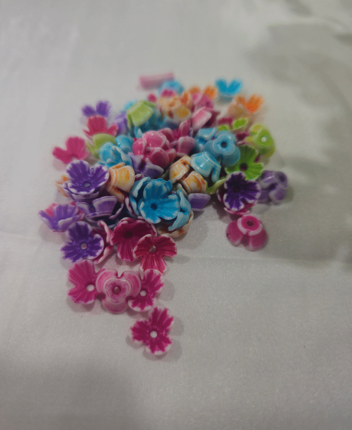 cd assorted flower beads in different designs for DIY craft projects.