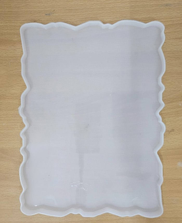 9x12 wavy-edge silicone resin tray mould on wooden surface
