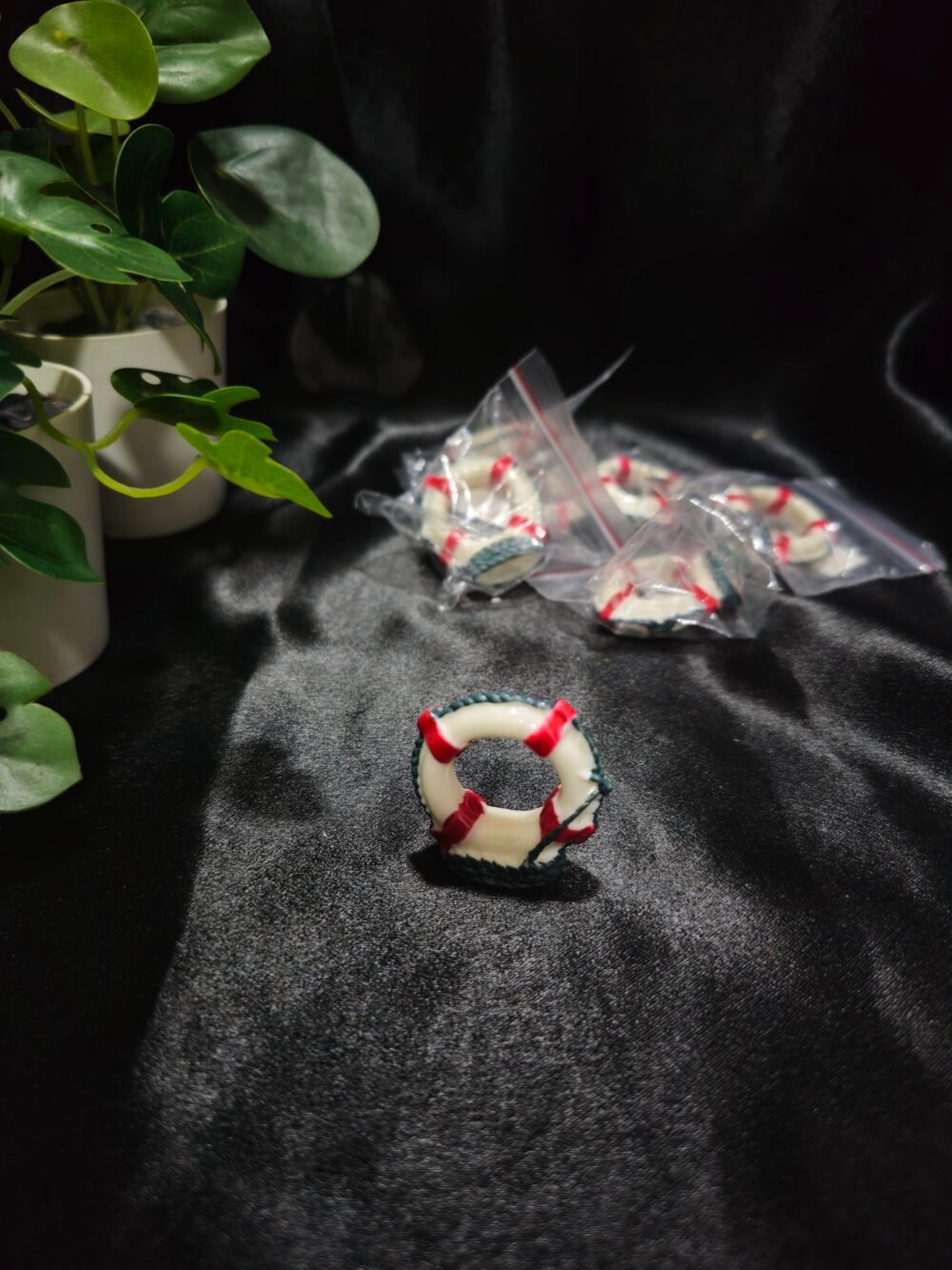 Miniature lifebuoy resin decoration with red and white detailing for craft and resin art projects