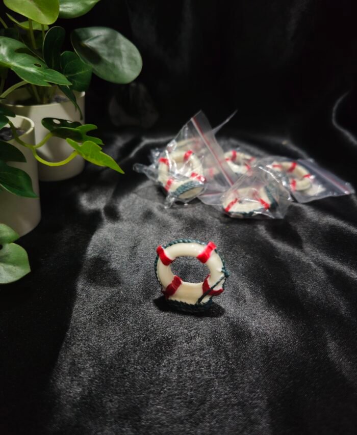 Miniature lifebuoy resin decoration with red and white detailing for craft and resin art projects