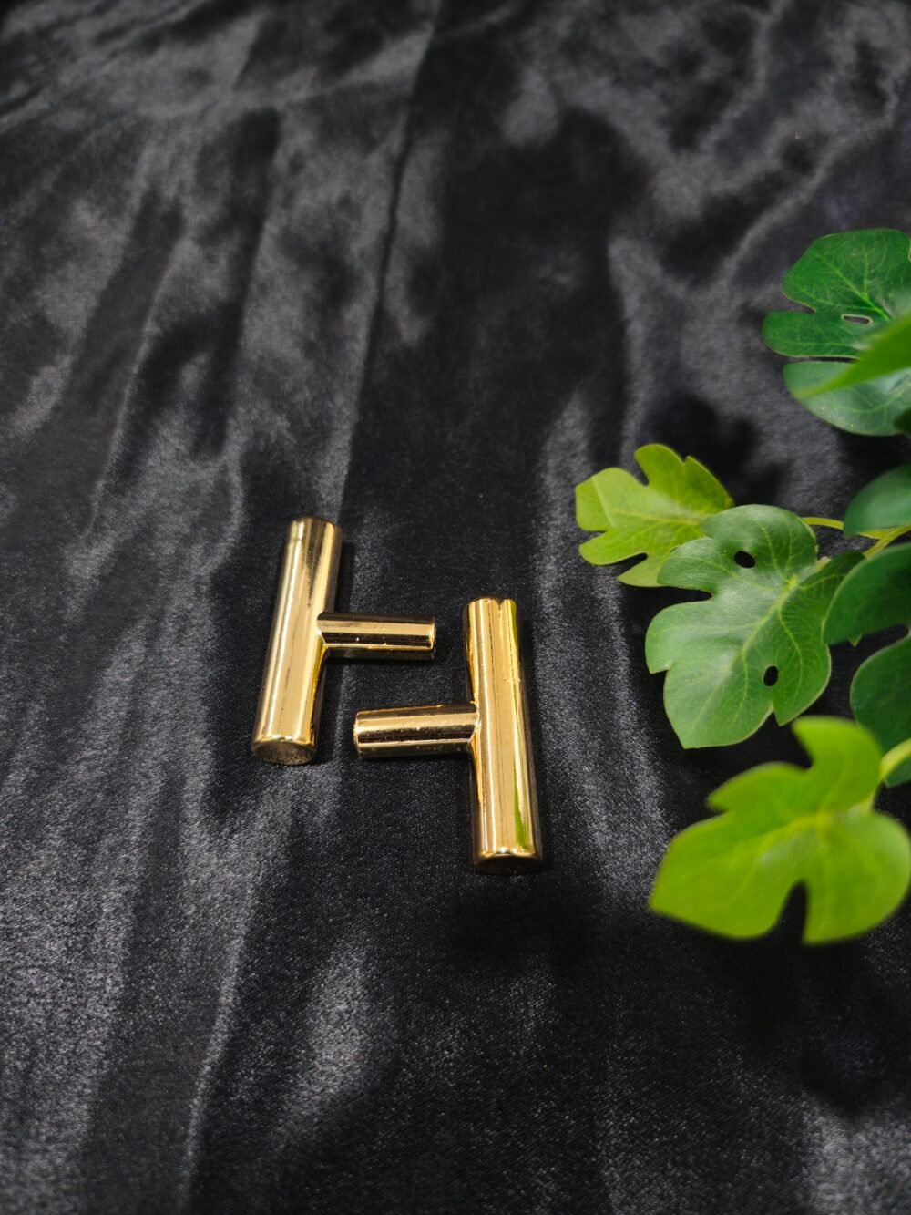 Gold T-shaped tray handle placed on a black fabric background for resin tray and cake stand use