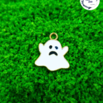 Decorative craft gost charms for resin art and jewellery making are displayed on a soft background
