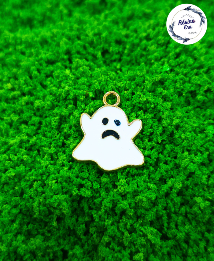 Decorative craft gost charms for resin art and jewellery making are displayed on a soft background