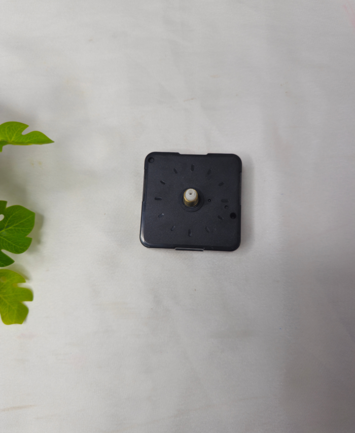 Black silent quartz clock machine with a central metal shaft for DIY wall clocks