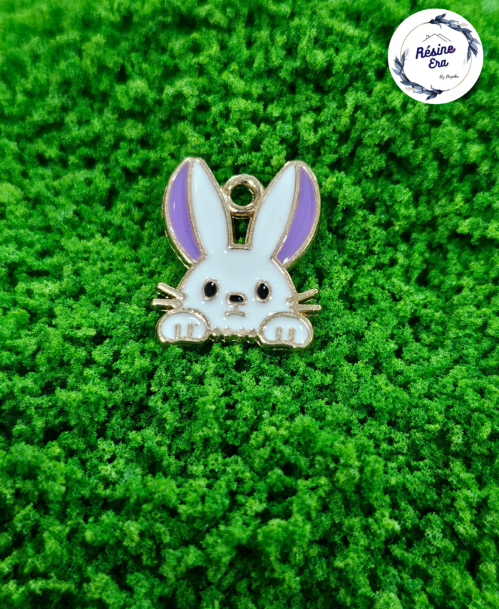 Decorative craft rabbit charms for resin art and jewellery making are displayed on a soft background