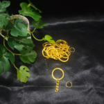 Metal keychain rings with attached chains displayed on a black cloth background, suitable for DIY keychain making and resin crafts.