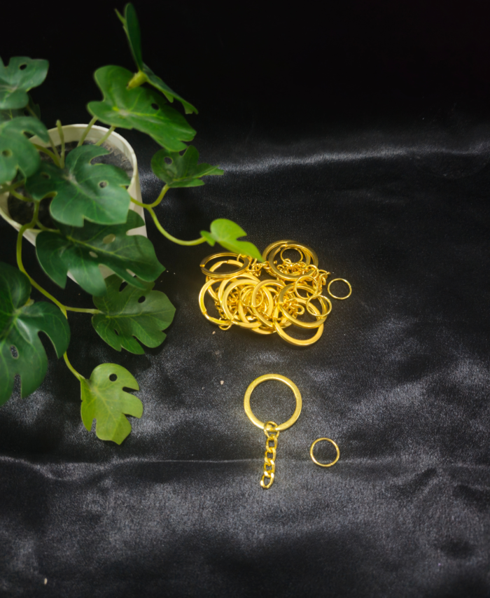 Metal keychain rings with attached chains displayed on a black cloth background, suitable for DIY keychain making and resin crafts.